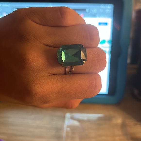 This is an Emerald ring. It is adjustable to fit the size of any of your finger - Picture 3 of 3